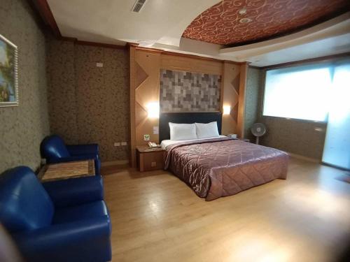 Postel nebo postele na pokoji v ubytování Wen Mei Motel