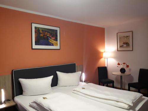 Postel nebo postele na pokoji v ubytování Hotel Luca
