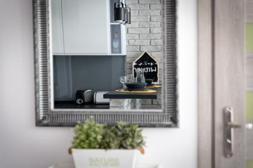 a mirror on a door with a bowl on a table at Asia in Nysa