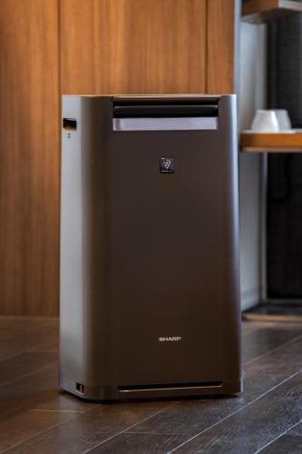 a refrigerator sitting on the floor in a kitchen at karaksa hotel grande Shin-Osaka Tower in Osaka