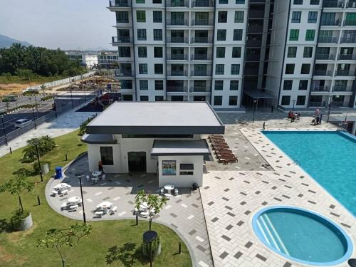 an overhead view of a building with a pool at Casahome by Irdina Meru- 8pax -10pax in Ipoh