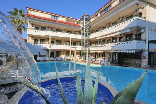 a view of the hotel from the pool at Philoxenia Hotel & Villas in Pefkochori