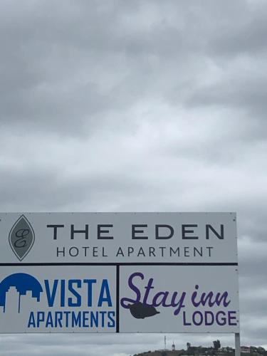 a sign that says the eden hotel appointment and stay inn lodge at The Eden Lodge Verulam in Verulam