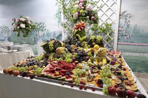 a large display of fruits and vegetables on a table at Edra Palace Hotel & Ristorante in Cassino