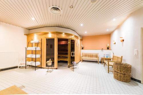 a large room with a table and chairs at Hotel am Schloß Apolda in Apolda