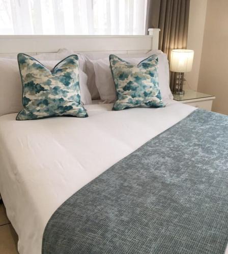 Ein Bett oder Betten in einem Zimmer der Unterkunft Peaches & Cream Bed & Breakfast