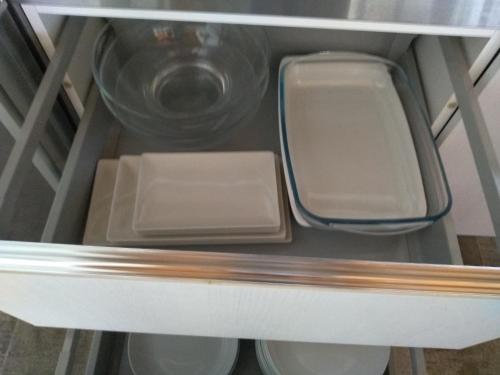 a refrigerator shelf with a sink and a bowl at Casa Rural Txokoetxe in Mungia