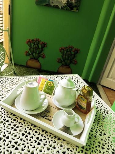 a tray with a tea set on a table at Bed & Breakfast Macallè in Catania