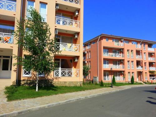 an empty street in front of an apartment building at Sunny Day 6 - Menada Apartments in Sunny Beach