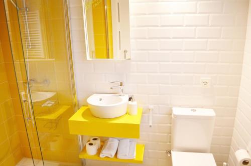 a bathroom with a sink and a toilet at Casa Rural Txokoetxe in Mungia
