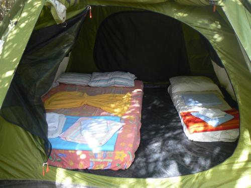 מיטה או מיטות בחדר ב-Camping Elizabeth