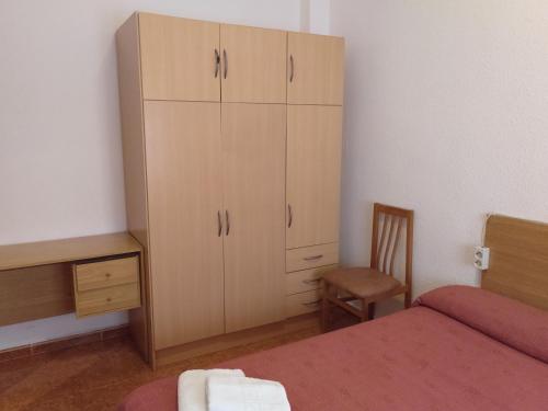 Postel nebo postele na pokoji v ubytování PENSION MIRAFLORES