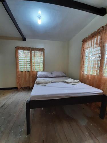 Postel nebo postele na pokoji v ubytování home stay rizalina