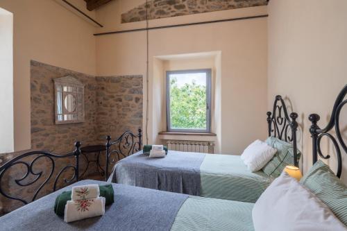 A bed or beds in a room at Podere Groppini