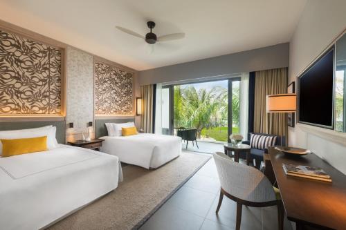 Postel nebo postele na pokoji v ubytování Anantara Iko Mauritius Resort & Villas
