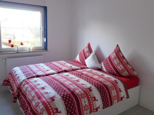 Ένα ή περισσότερα κρεβάτια σε δωμάτιο στο Ferienhaus Astenblick für große Gruppen - Familienfeiern oder Betriebsfeiern