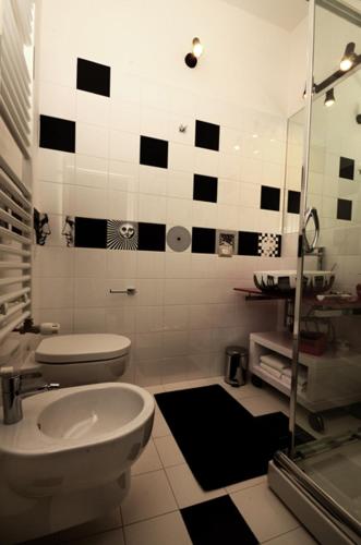 a bathroom with a toilet and a sink at Bedrooms B&B in Pescara