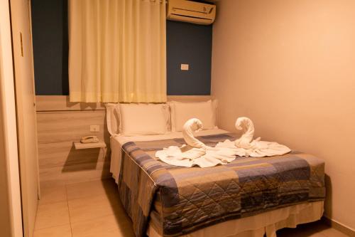 Ένα ή περισσότερα κρεβάτια σε δωμάτιο στο Pousada Mariluz