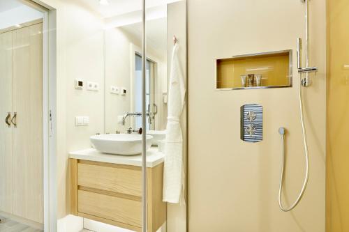 a bathroom with a sink and a shower at 7Pines Resort Ibiza, part of Destination by Hyatt in San Jose