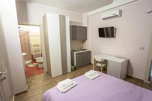 Postel nebo postele na pokoji v ubytování San Andreas Suites