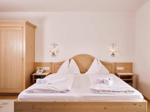 Postel nebo postele na pokoji v ubytování Hotel Blattlhof
