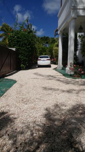 a car parked in the driveway of a house at 11 Gibbs Glade in Saint Peter