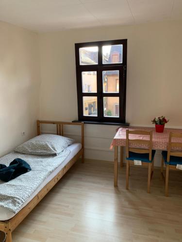 Un ou plusieurs lits dans un hébergement de l'établissement Belle Vue Apartrooms