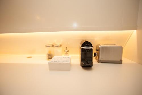 a kitchen counter with a toaster and a toaster and a toaster at Prince Royal B&B in Amsterdam