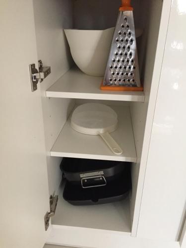 a white cabinet with a sink and a bowl at Luxury Suite - Amazing Views & Lovely Garden in Salalah