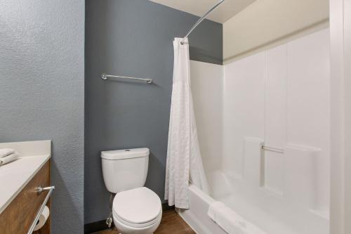 a bathroom with a toilet and a shower at Extended Stay America Premier Suites - Union City - Dyer St in Union City