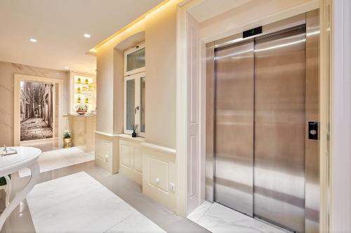 a bathroom with a shower and a sink at Piazza Heritage Hotel in Split