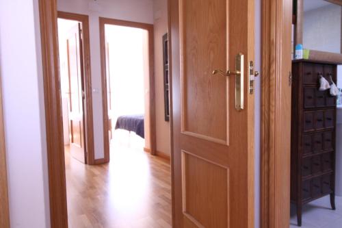 an open door to a room with a hallway at Chalet Aldeamayor Golf Licencia 47269 in El Cardiel