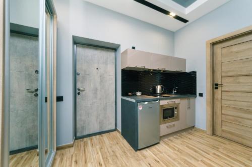 Кухня или мини-кухня в Tomas apartments
