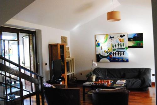 a living room with a couch and a table at Luci sui Monti in Sarnano