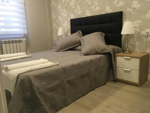 Ένα ή περισσότερα κρεβάτια σε δωμάτιο στο Apartamento Expectacular,céntrico,nuevo 5 min a pie de la Laurel Vivienda de uso Turistico