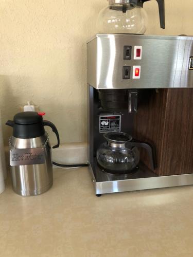 a coffee maker with a tea kettle on top of it at Honeysuckle Inn in Mountain View