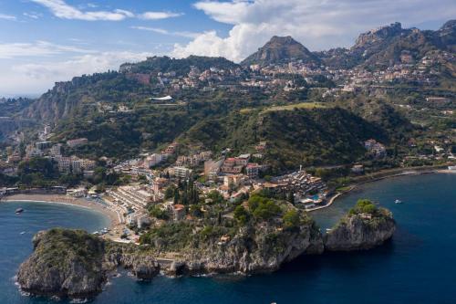 an aerial view of a small island in the ocean at Fenetre sur le blue in Taormina