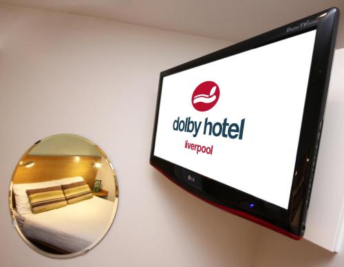 a television with a mirror next to a hotel room at The Dolby Hotel Liverpool - Free city centre parking in Liverpool