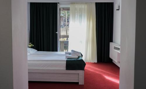Lova arba lovos apgyvendinimo įstaigoje Hotel Cirus