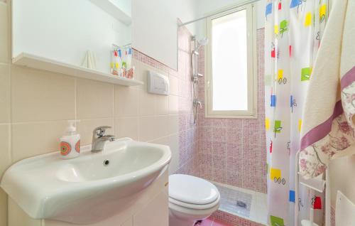 a bathroom with a sink and a toilet and a shower at Casa Terry 1 in Menfi