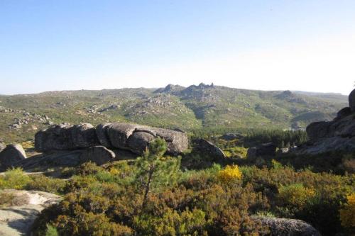 a view of a mountain with rocks and trees at Casa Oeste in Sabugueiro