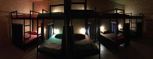 a group of bunk beds in a room at HomeHostel in Ko Chang