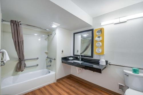 a bathroom with a sink and a toilet and a tub at Motel 6-Odenton, MD - Fort Meade in Odenton
