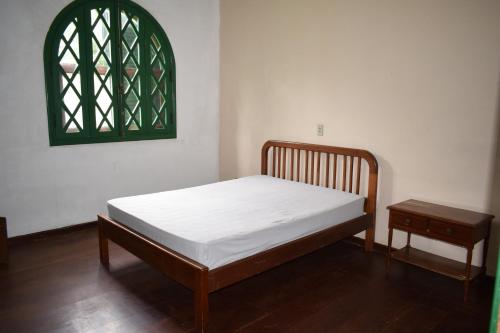 En eller flere senge i et værelse på Chácara Dona Eulália