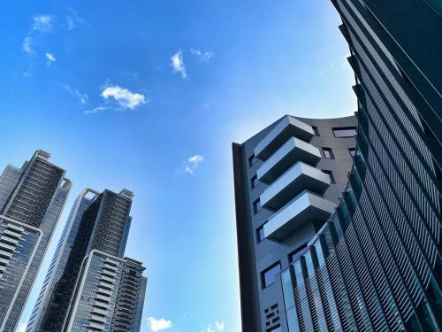 a group of tall buildings in a city at Hotel Indigo Taipei North by IHG in Taipei