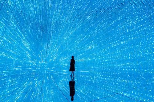 a man standing in a room with a blue background at The Venetian Macao in Macau