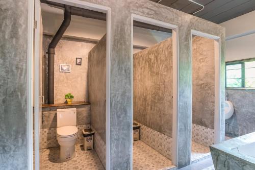 a bathroom with a toilet and a sink at Sanim Hostel in Ao Nang Beach