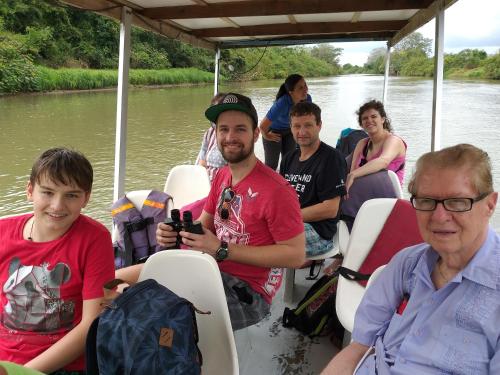 a group of people on a boat on a river at Hotel Rio Celeste Finca L´ Etoile Celeste in El Achiote