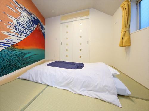 Posteľ alebo postele v izbe v ubytovaní COTO Tokyo Shibuya 7