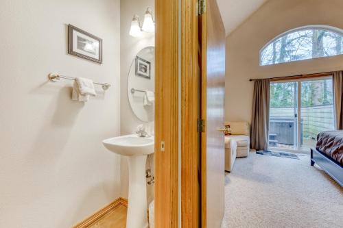 a bathroom with a sink and a mirror at Clark's Mountain Condo in Welches